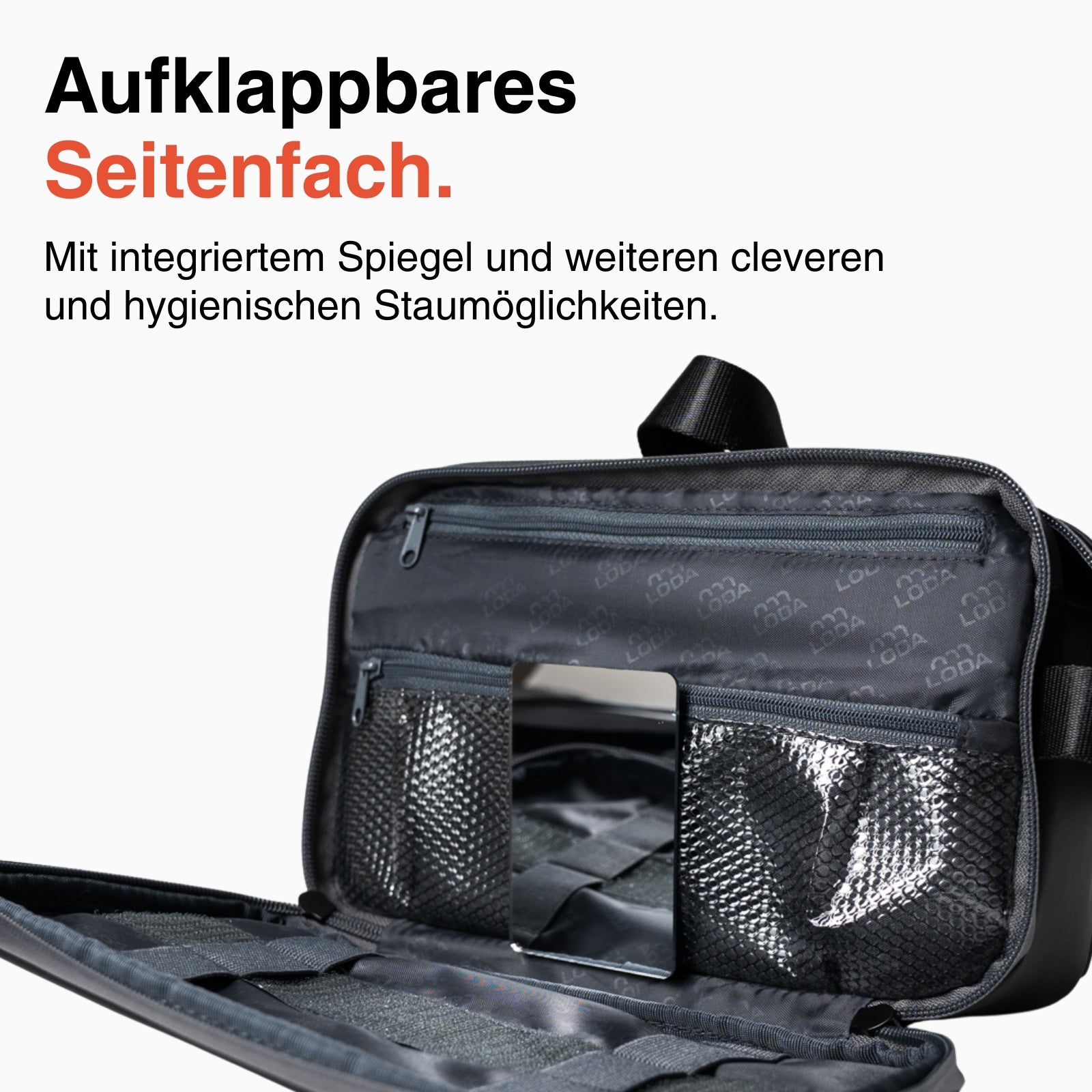 Der LODA sports LODA Kulturbeutel verfügt über Netztaschen, einen eingebauten Spiegel und eine Innenausstattung aus schwarzem Stoff, die offen vor einem weißen Hintergrund gezeigt wird.